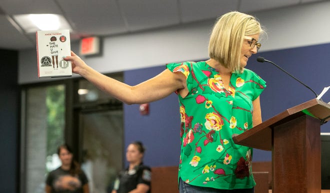 Melissa Bakondy quotes lines from "The Hate U Give" by Angie Thomas to the members of the Sarasota County School Board and Superintendent Brennan Asplen during an open meeting at the School Board of Sarasota County building. Concerned residents made their arguments in support of and against teaching critical race theory and wearing masks in school. MATT HOUSTON / HERALD-TRIBUNE
