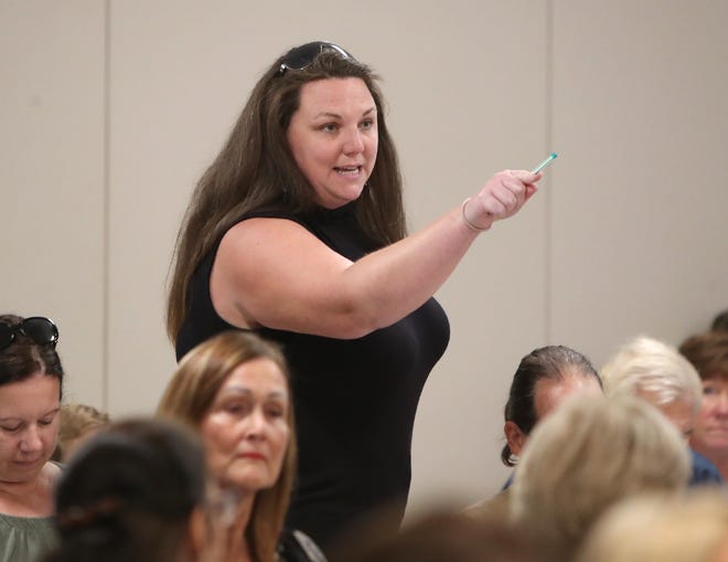 Ashely Cote directs comments towards members of the Sarasota County School Board and Superintendent Brennan Asplen during an open meeting at the School Board of Sarasota County building. Concerned residents made their arguments in support of and against teaching critical race theory and wearing masks in school. MATT HOUSTON / HERALD-TRIBUNE