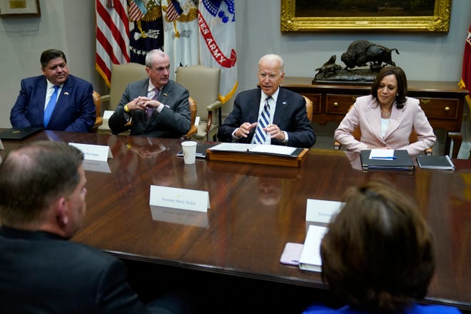 Illinois Gov. JB Pritzker, left, listens as President Joe Biden, center, speaks during a meeting with a bipartisan group of governors and mayors and cabinet officials in the Roosevelt room of the White House in Washington Wednesday, July 14, to discuss the bipartisan infrastructure deal in the Senate. Flanking Biden are Labor Secretary Marty Walsh, left, and Vice President Kamala Harris, right. (AP Photo/Susan Walsh)