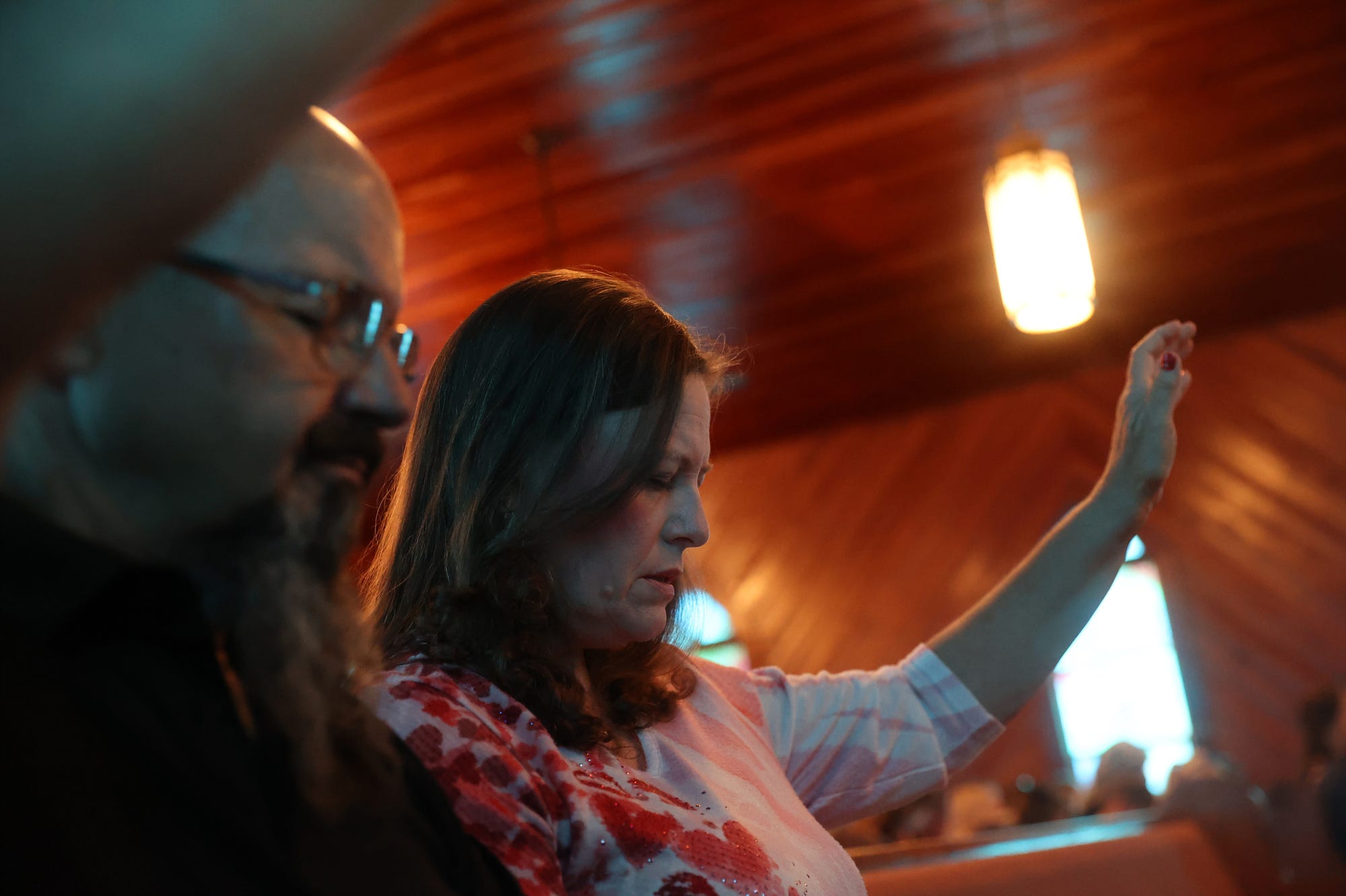 Susan and Gene Marsh pray during the Sunday service at Oaky Grove Church in Wrightsville, Georgia. Church has always been a big part of Susan's life and the support from fellow members has been important throughout her treatment.