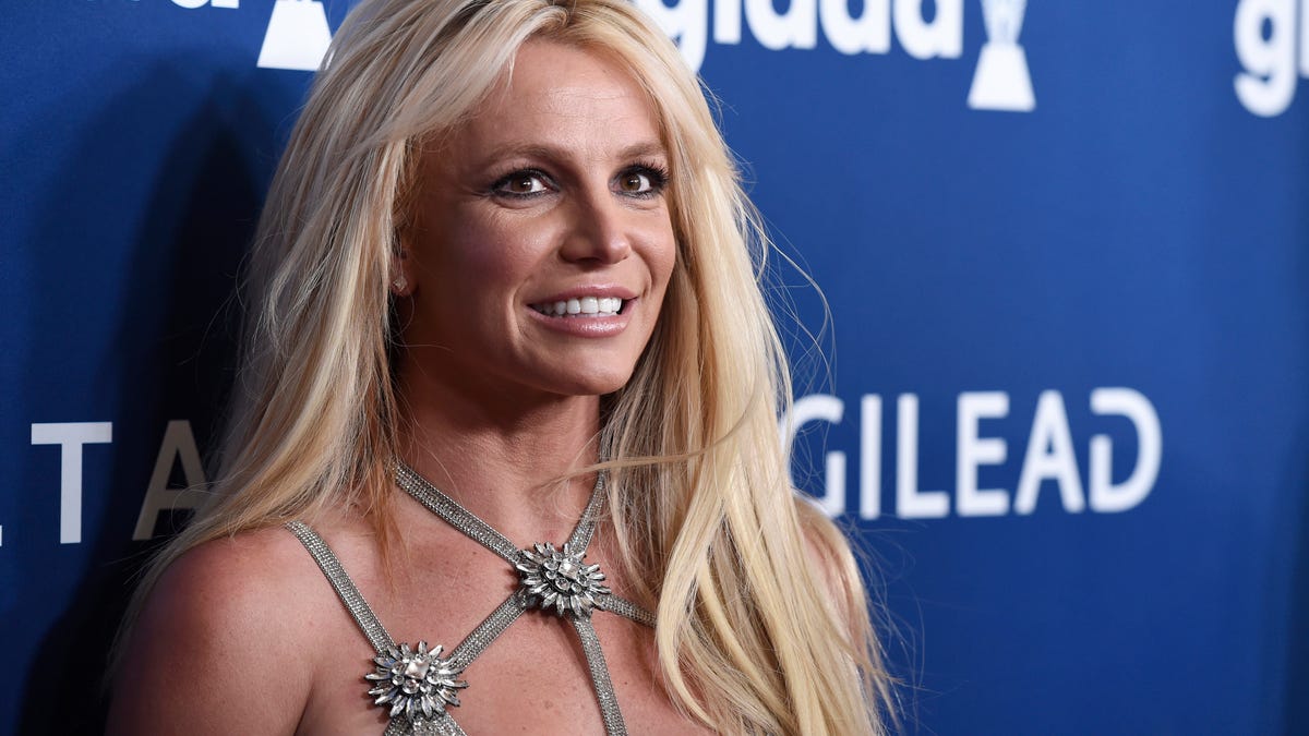 In this April 12, 2018 file photo, Britney Spears arrives at the 29th annual GLAAD Media Awards at the Beverly Hilton Hotel in Beverly Hills, Calif.   Spears is putting her planned Las Vegas residency on hold to focus on her father's recovery from a recent life-threatening illness.  The pop superstar announced Friday, Jan. 4, 2019 she is going on an indefinite work hiatus.