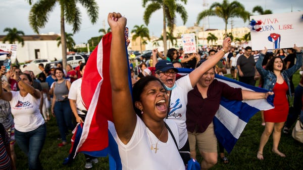 Rosa Maso, who is originally from Cuba chants whil