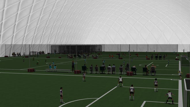 A wide view of the future Somersworth sports dome set up for multiple soccer games.