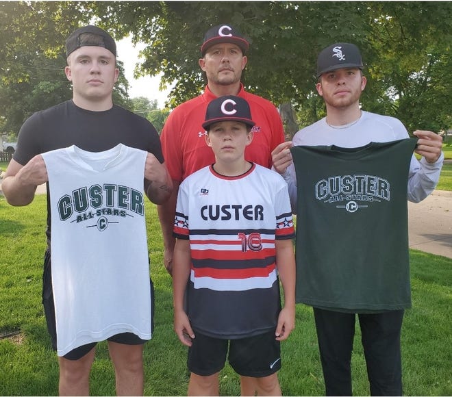Chuck Brooks (rear) helped Monroe win a Monroe County Fair Baseball Tournament championship with Monroe in 1989. His sons Caden (right) and Hayes (left) played for runner-up teams at the Fair with Custer. Youngest son Grady (center) will be bidding for a title this year with his father as the manager.