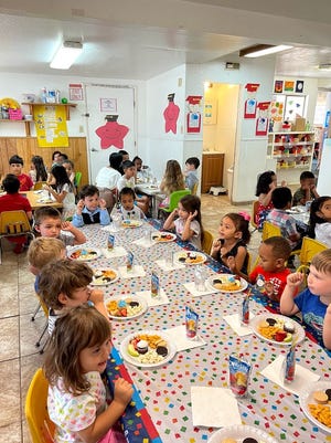 Children enjoy a meal at Parvin's Hopeland Preschool, Kindergarten, and Childcare Center in Stockton, California.