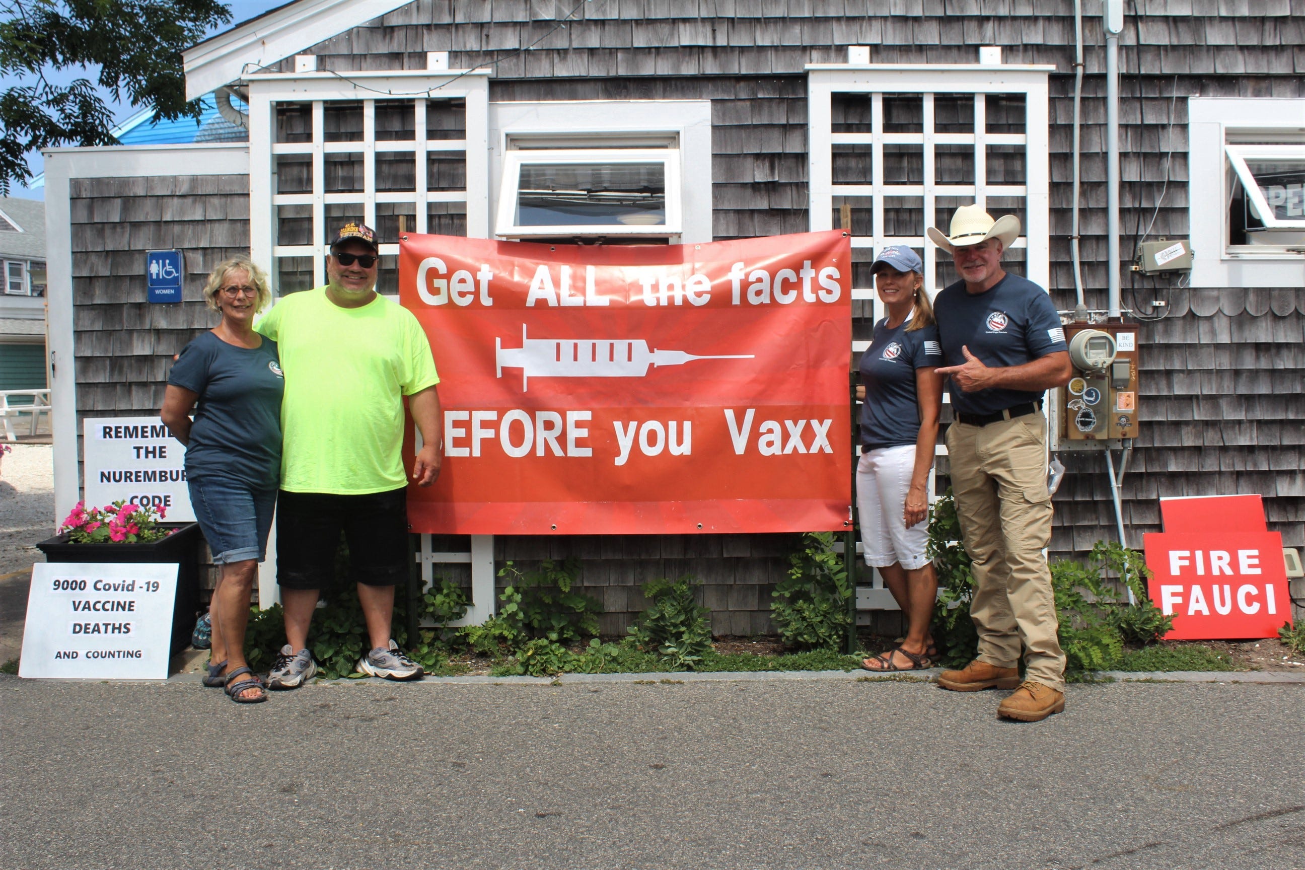 Four people of the grass-roots conservative group, United Cape Patriots, stand outside the state's VaxBus handing out flyers. 

"We're not anti-vax, we're about freedom", said United Cape Patriots founder Adam Lange.