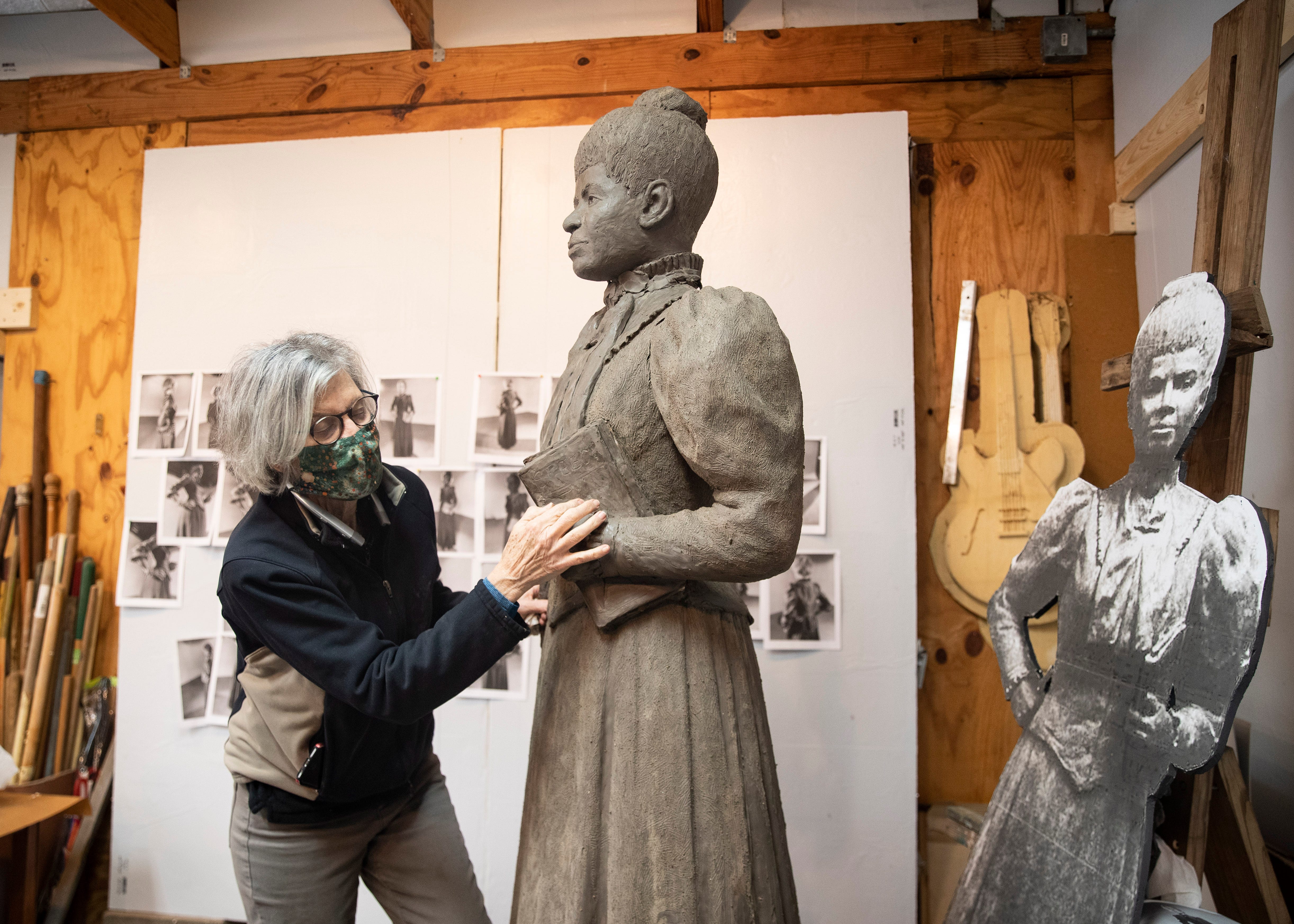 Andrea Lugar of the Lugar Bronze Foundry in Eads, Tenn.,  sculpts the statue of Ida B. Wells-Barnett, the African American civil rights advocate and journalist who fought against racism, segregation and lynching, at her home studio on Friday, March 15, 2021.