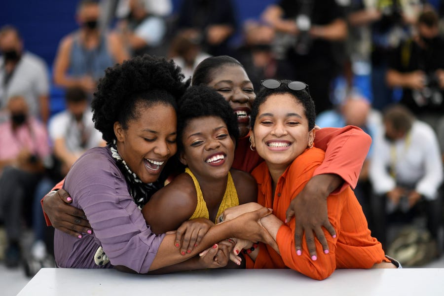 (From left) Haitian director Gessica Geneus, Haitian actress Nehemie Bastien, Haitian actress Fabiola Remy and Haitian actress Djanaina Francois pose during a photocall for the film "Freda" as part of the Un Certain Regard selection at the 74th edition of the Cannes Film Festival, France, on July 15, 2021.