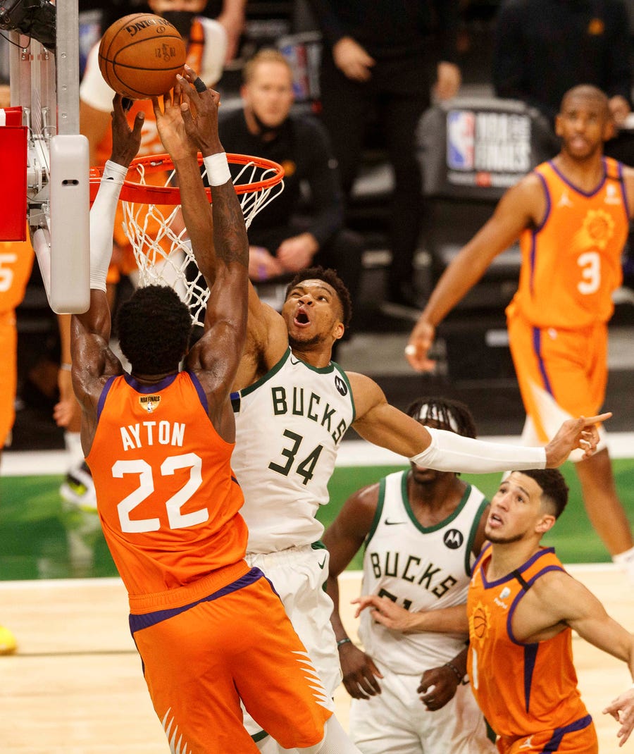 Giannis Antetokounmpo blocks a shot by the Suns' Deandre Ayton during Game 4 of the NBA Finals.