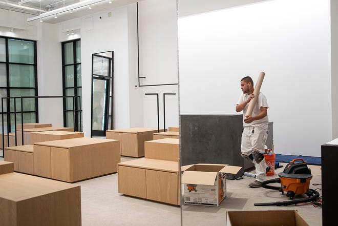 Satterfield Construction foreman Elvis Nunez is working on Friday to finalize the details of the construction of the Alo Yoga store at South Congress. Austin saw the unemployment rate decline in June amid a resurgent economy.