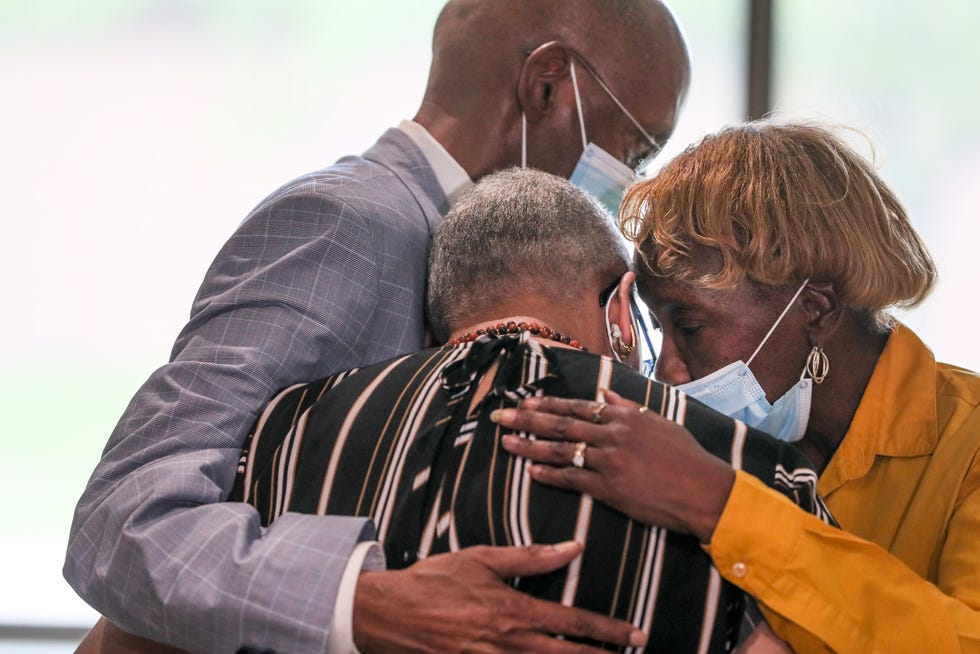 Individuals embrace Valeria Spinner-Banks, the mother of Amarah "Jerica" Banks, after the sentencing of the Milwaukee man, Arzel Ivery,  who murdered Amarah Banks and her two young children, Zaniya and Camaria Friday at Sojourner in Milwaukee.