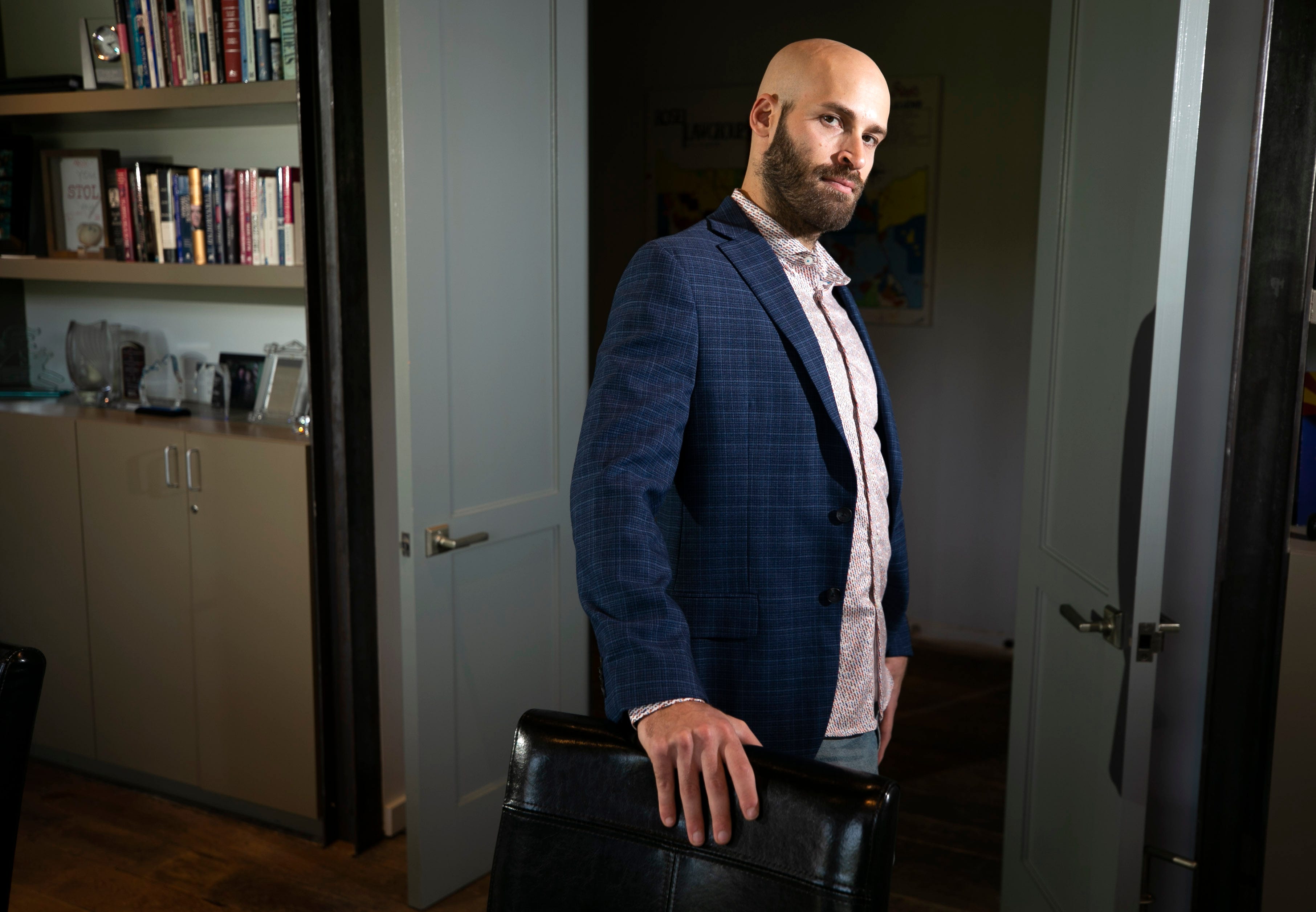 Jonathan Udell is an attorney with the Rose Law Group and a communications director with Arizona NORML. He is seen at the Rose Law Group offices in Scottsdale on July 16, 2021.