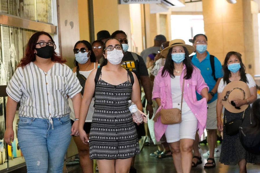Visitors wear masks in a shopping district in Hollywood on July 1. Coronavirus cases jumped 500% in Los Angeles County over the past month, and health officials warned July 13 that the especially contagious delta variant spread rapidly among California's unvaccinated population.