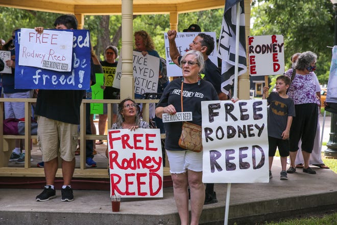 A crowd of about 50 gathers Saturday outside the Bastrop County Courthouse to call for Rodney Reed to be removed from death row. Reed was convicted 23 years ago at the same courthouse.