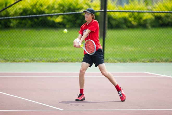 Tyler Brinkmeyer plays Jared Mitchell, not pictured, during the Freeport City Tennis Tournament at Read Park Saturday, July 17, 2021, in Freeport.