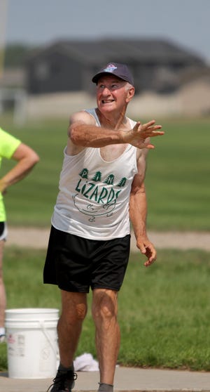 South Dakota Senior Games executive director Howard Bich throws in the shot put competition at Saturday's portion of the Aberdeen Senior Games at Swisher Field. American News photo by Jenna Ortiz, taken 07/17/2021.