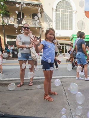 Youngsters enjoy a bubble machine during a previous Gallery Night. This month's event will take place Friday.