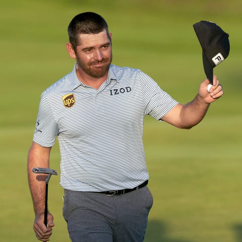 Louis Oosthuizen acknowledges the gallery after hi