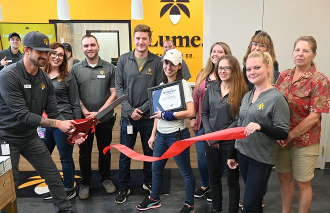 Coldwater Chamber of Commerce staff and employees of Lume cut the opening ribbon Friday at 351 S. Willowbrook.