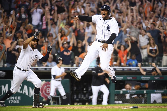 Detroit Tigers first baseman Jonathan Schoop (7) celebrates after scoring the game winning run during the eighth inning against the Minnesota Twins during Game 2 of a doubleheader at Comerica Park in Detroit on Saturday, July 17, 2021.