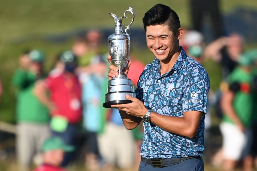 Final round: Collin Morikawa poses for pictures with the Claret Jug.