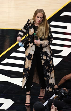 Everything We Know About Adele ’s New Album 6 Adele walks in during the second half in Game Five of the NBA Finals.