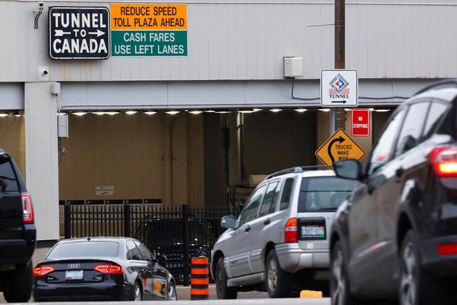 FILE - In this March 16, 2020, file photo, vehicles enter the Detroit-Windsor Tunnel in Detroit to travel to Canada. The Canada Border Services Agency has rejected a creative plan by Windsor Mayor Drew Dilkens to have Ontario residents line up inside the tunnel to get COVID-19 vaccinations. (AP Photo/Paul Sancya, File)