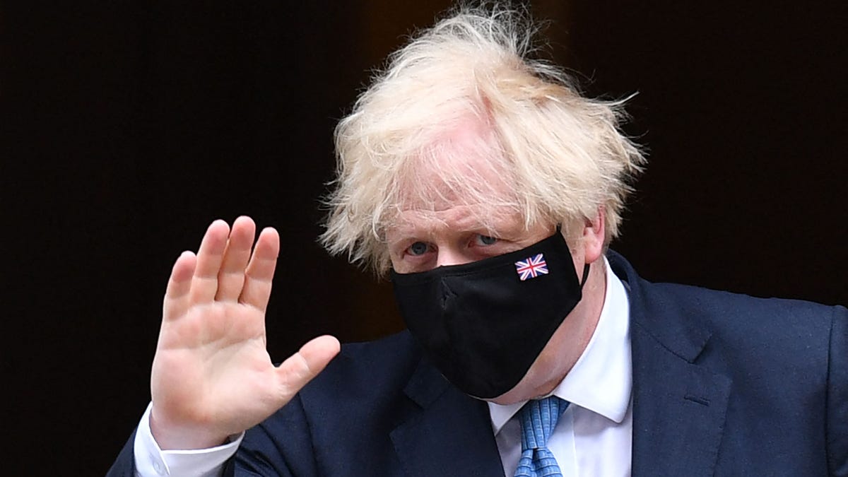 In this file photo taken on July 14, 2021 Britain's Prime Minister Boris Johnson leaves number 10 Downing Street in central London on July 14, 2021, to take part in Prime Minister's Questions (PMQ) session in the House of Commons.