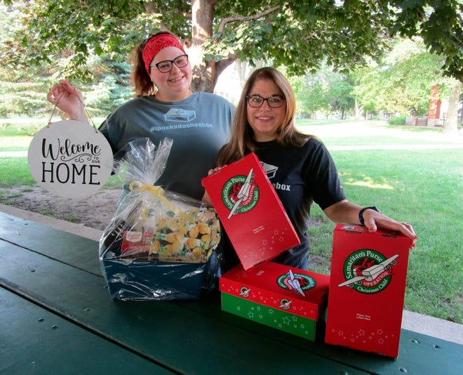 Courtney (Emerick) Morrison, left, and Shelly Emerick, representing Operation Christmas Child outreach, are shown with some of the raffle items that have been donated and will be awarded in drawing at the upcoming Craft and Vendor Fair that benefits Operation Christmas Child. Shelly Emerick also shows some of the shoeboxes that need to be filled for the effort to be a success