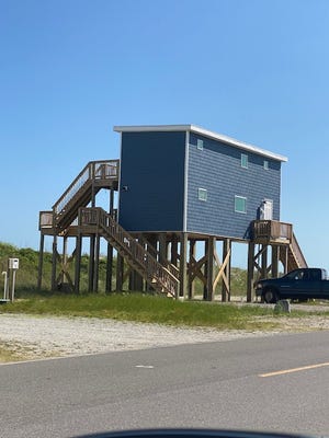 The Lyalls' tiny beach house stands out among other vacation homes along New River Inlet Road.
