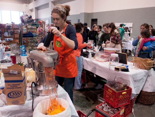 During a previous Worcester Vegfest, usually held at the DCU, Amanda Barker of Worcester, manager of Pure Juz, makes a smoothie called "The Cure," using a 20 amp. industrial juicer. This year the event is planned virtually from July 25 to Aug. 1.