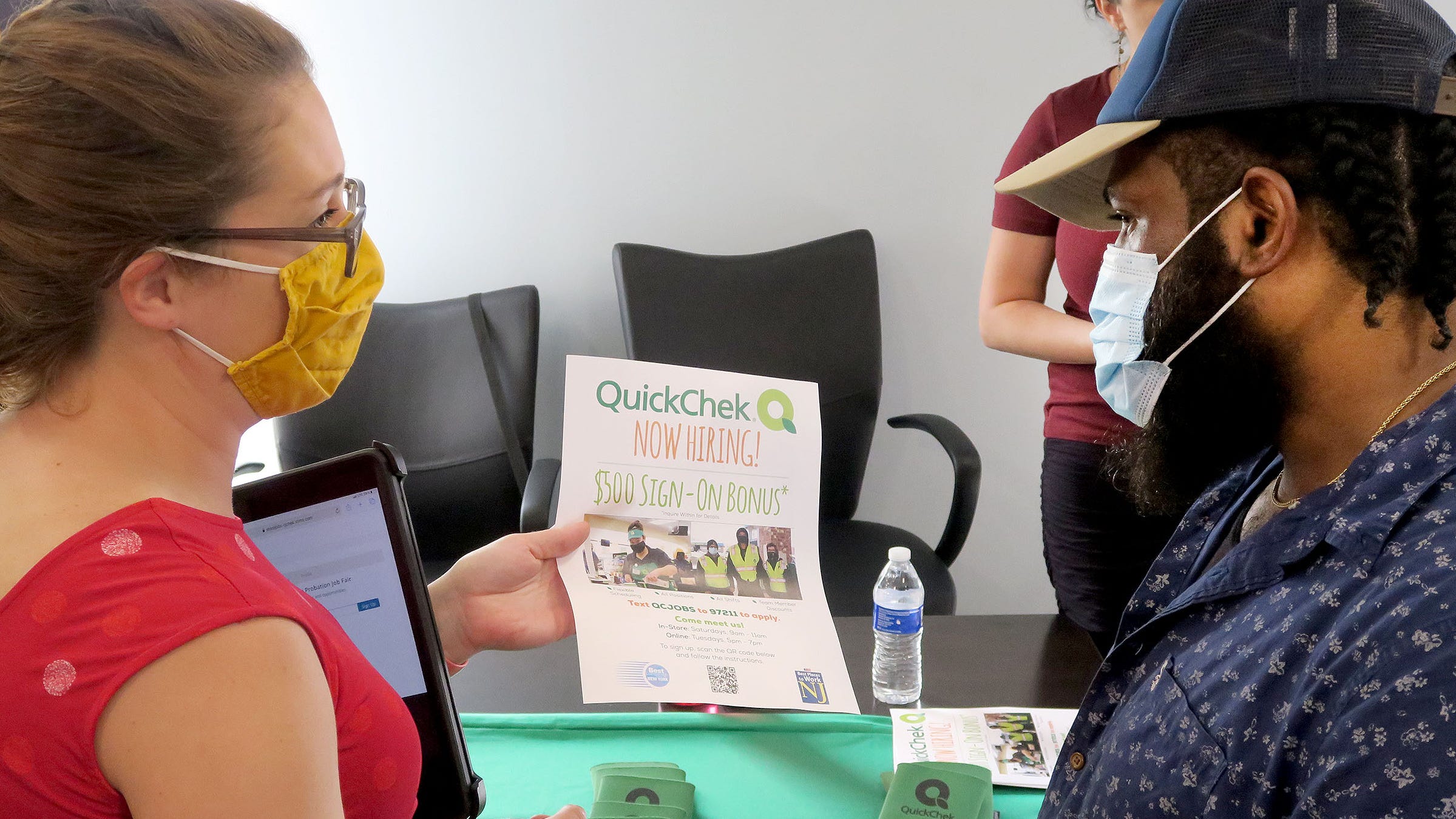 Sharif Huntley, Asbury Park, speaks with Kim Scully, leader of recruiting and employee relations at Quik Chek, Tuesday, July 20, 2021, in Ocean Township. Monmouth County and the New Jersey Courts held a job fair for people on probation in a bid to give workers a second chance and help local employers, pressed during a labor shortage, to find employees.