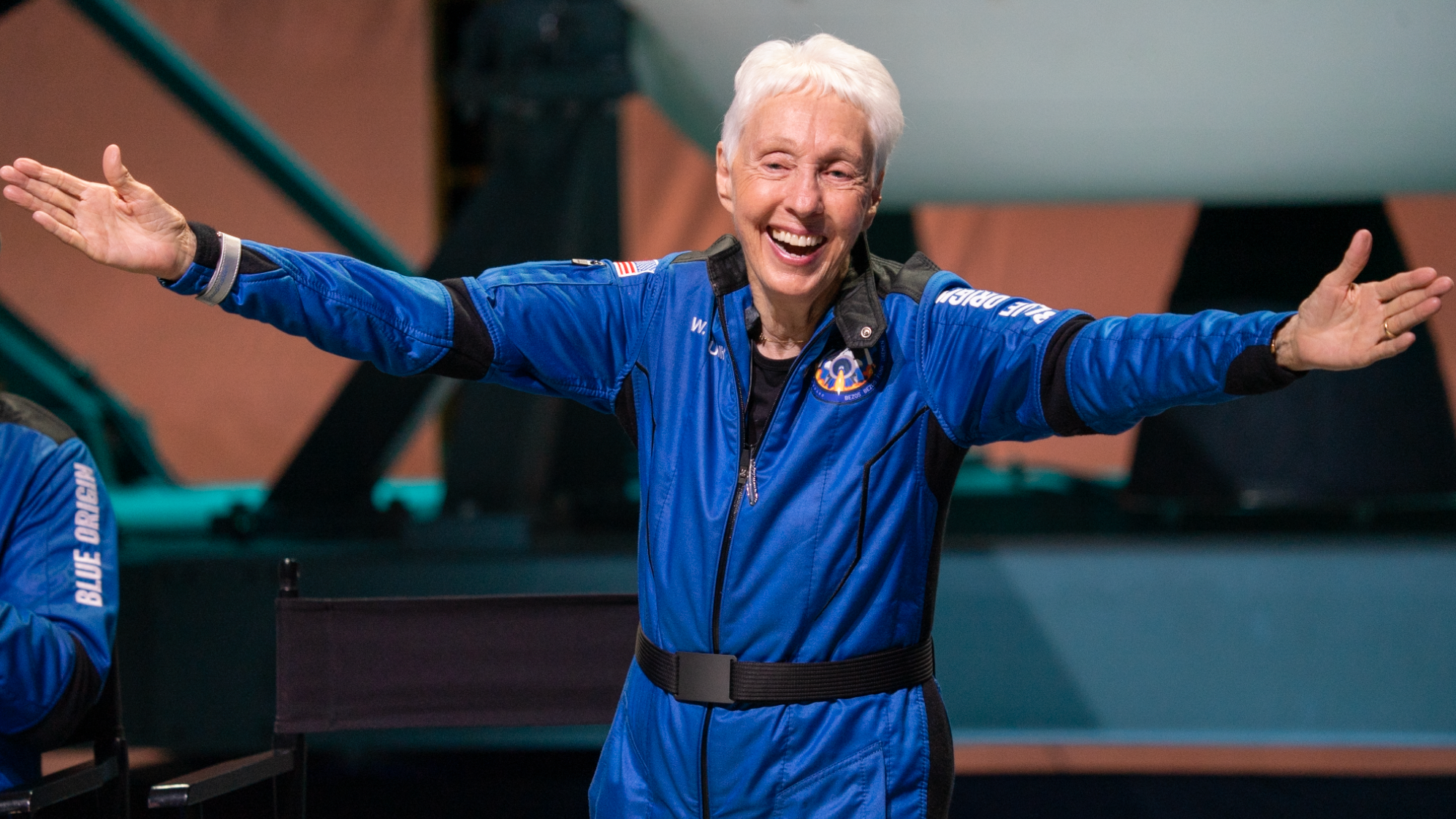 Wally Funk, 82, celebrates after her successful flight on New Shepard on Tuesday, July 20, 2021. She is officially the oldest person to have traveled to space.