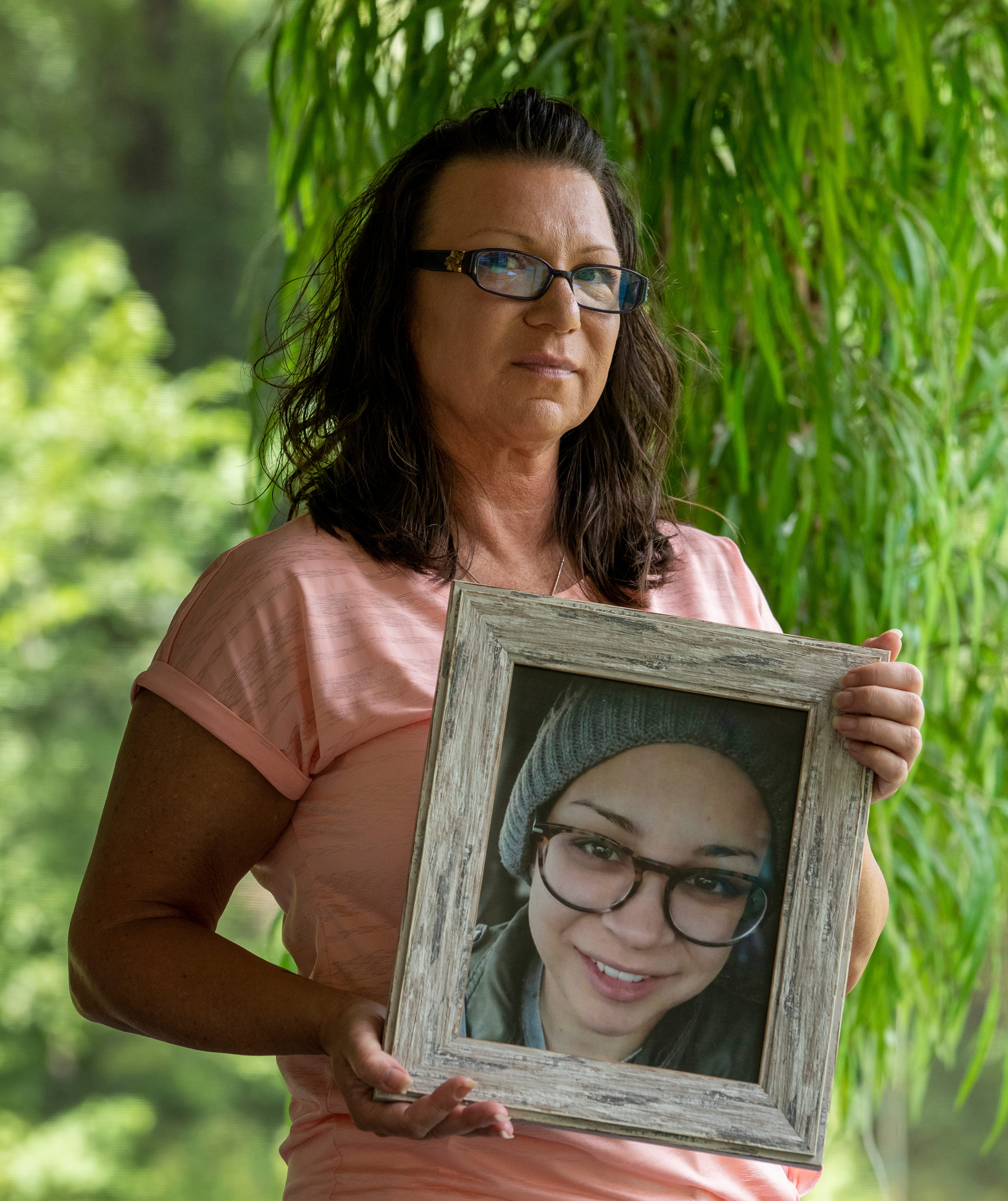 Tamara Meyers holds a photo of her daughter Tia Meyers at home on Tuesday, July 13, 2021, nearly a year since the death of Tia in the nearby Whitley County Jail. She had struggled with drug addiction, and her death, three days after intake, was ruled due to methamphetamine toxicity.