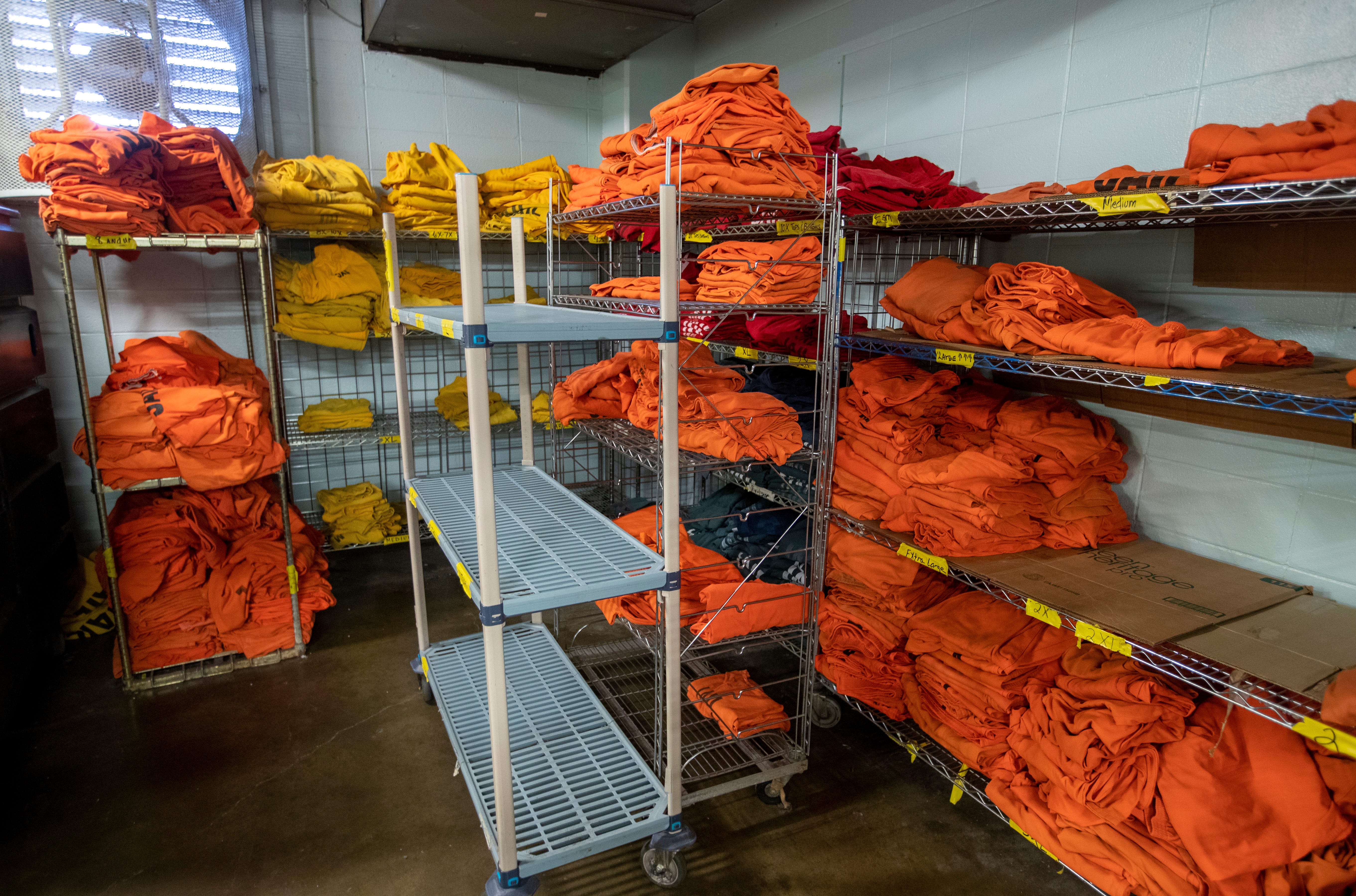 Orange clothing on racks on Thursday, July 15, 2021, at downtown Indianapolis' Marion County Jail 1. The facility, in its current configuration since 1985 is going to be replaced with a modern jail at the under-construction Community Justice Campus. Officials point to their aging facility as a reason for increased stress among inmates.