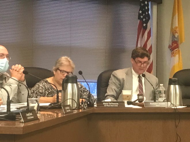 Mayor Richard Corcoran, right, and Boonton council members hear from the public before voting 7-1 in favor of approving retail and wholesale cannabis operations in town. July 19, 2021.