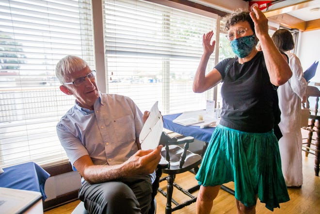 Don Foldenauer talks with former student Ruth Olin about a booklet she made in his class. Foldenauer's Beverly Shores fourth and fifth grade classes from the 1960s had a reunion last week at the Michigan City Yacht Club in Michigan City.