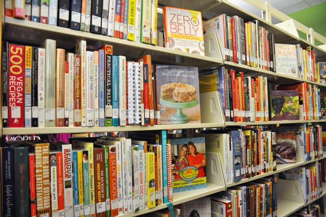 Cookbooks fill several shelves at the Abilene Public Library's Mockingbird Lane branch. They are to serve as inspiration for Cookbook Club participants to cook new recipes.