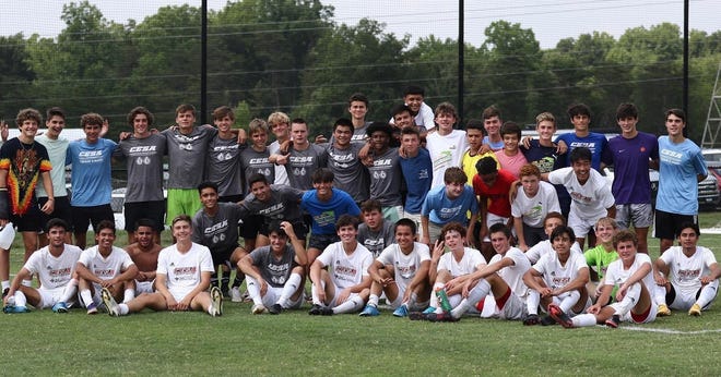 Members of the Carolina Elite Soccer Academy boys Under 17, 16 and 15 teams pose in Greensboro after qualifying for the Elite Nationals.