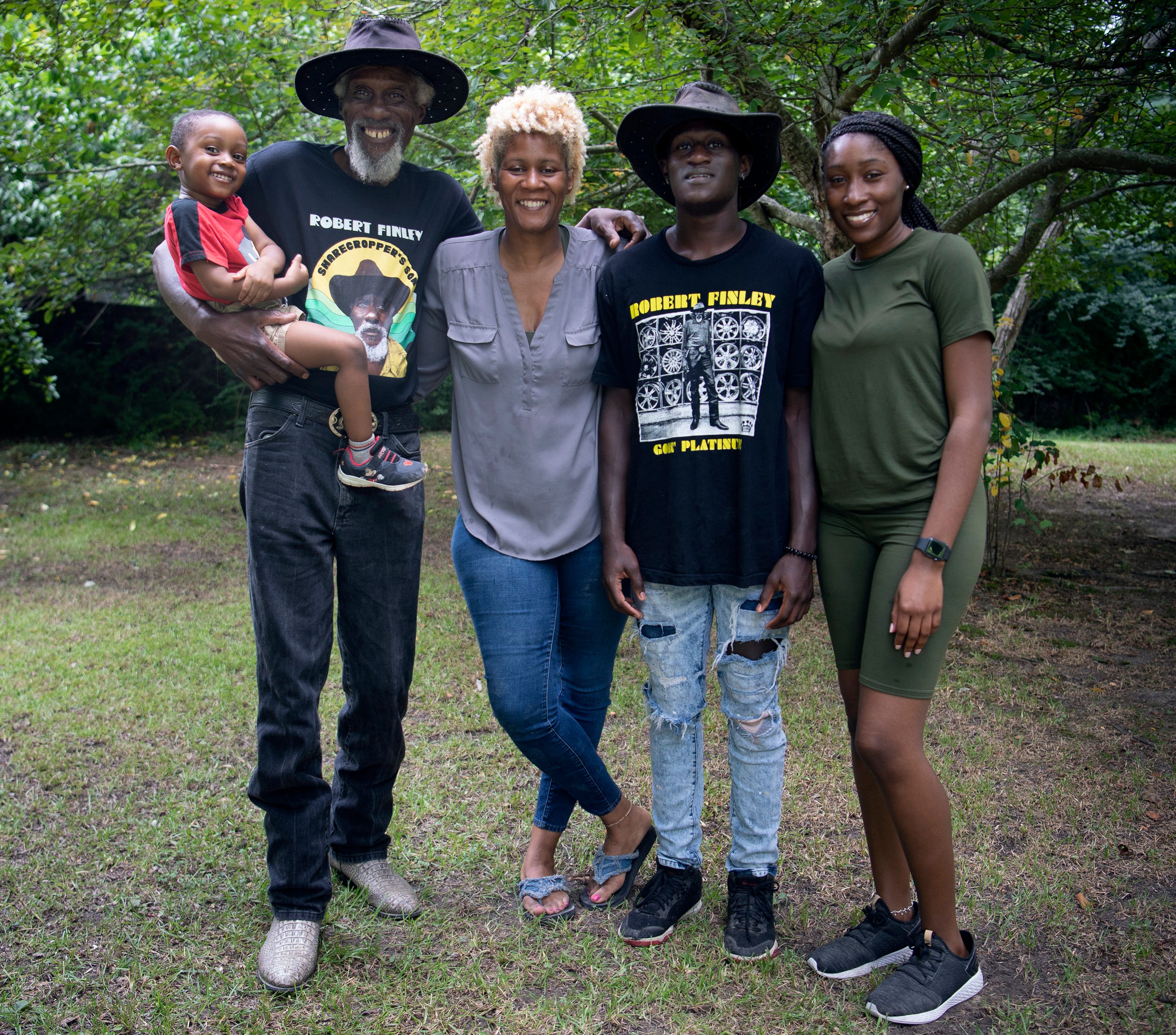 Robert Finley is close to the rest of his family in Bernice, Louisiana. Here he is with, from left. great-grandson Elijah McMahon, daughter Christy Johnson, and grandchildren Andre and LaQuindrelyn McMahon. Photographed Friday, July 16, 2021 in Bernice, La.