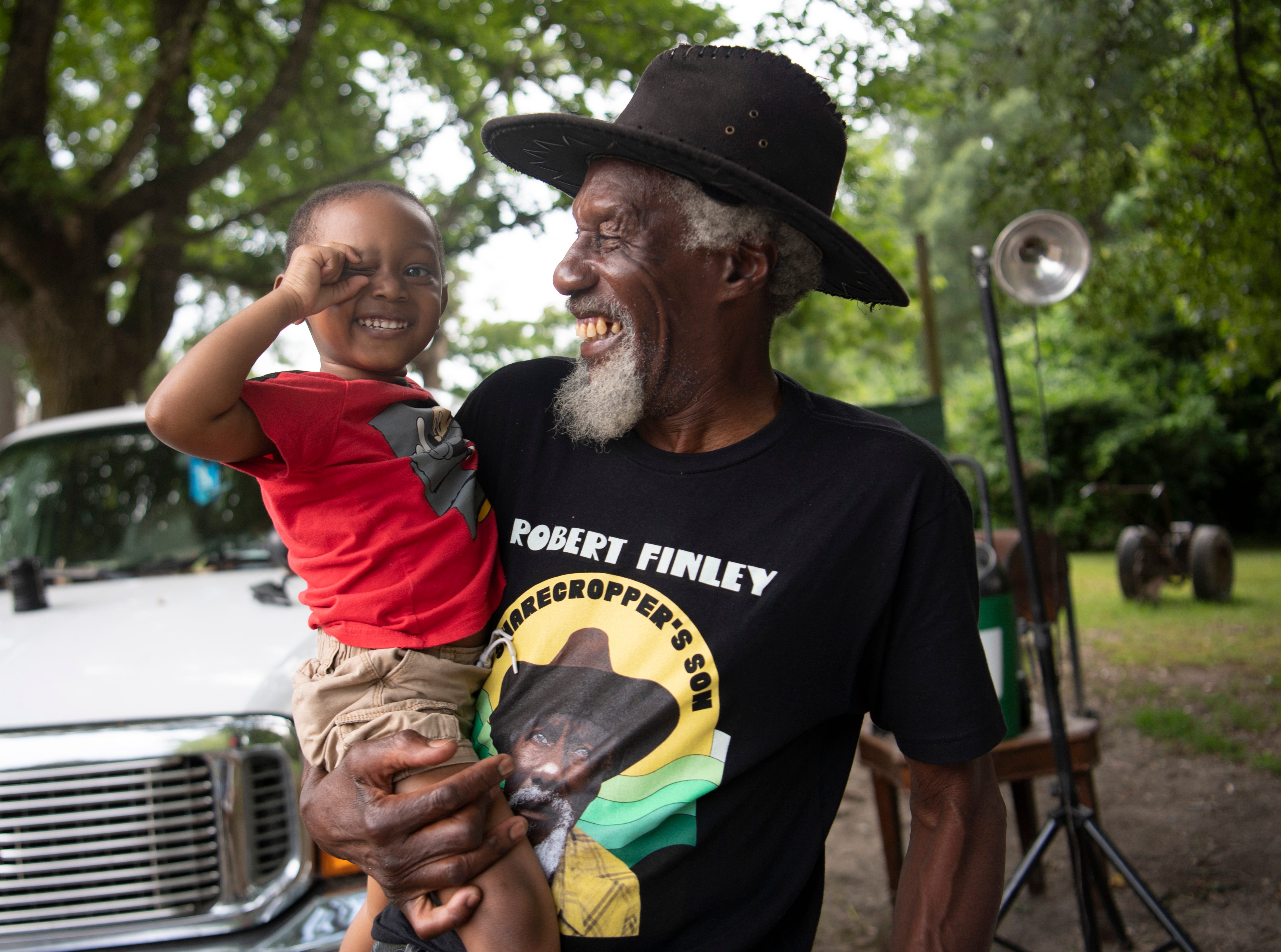 Robert Finley shares a laugh with great-grandson Elijah McMahon at his home in Bernice, La.  Photographed Friday, July 16, 2021.