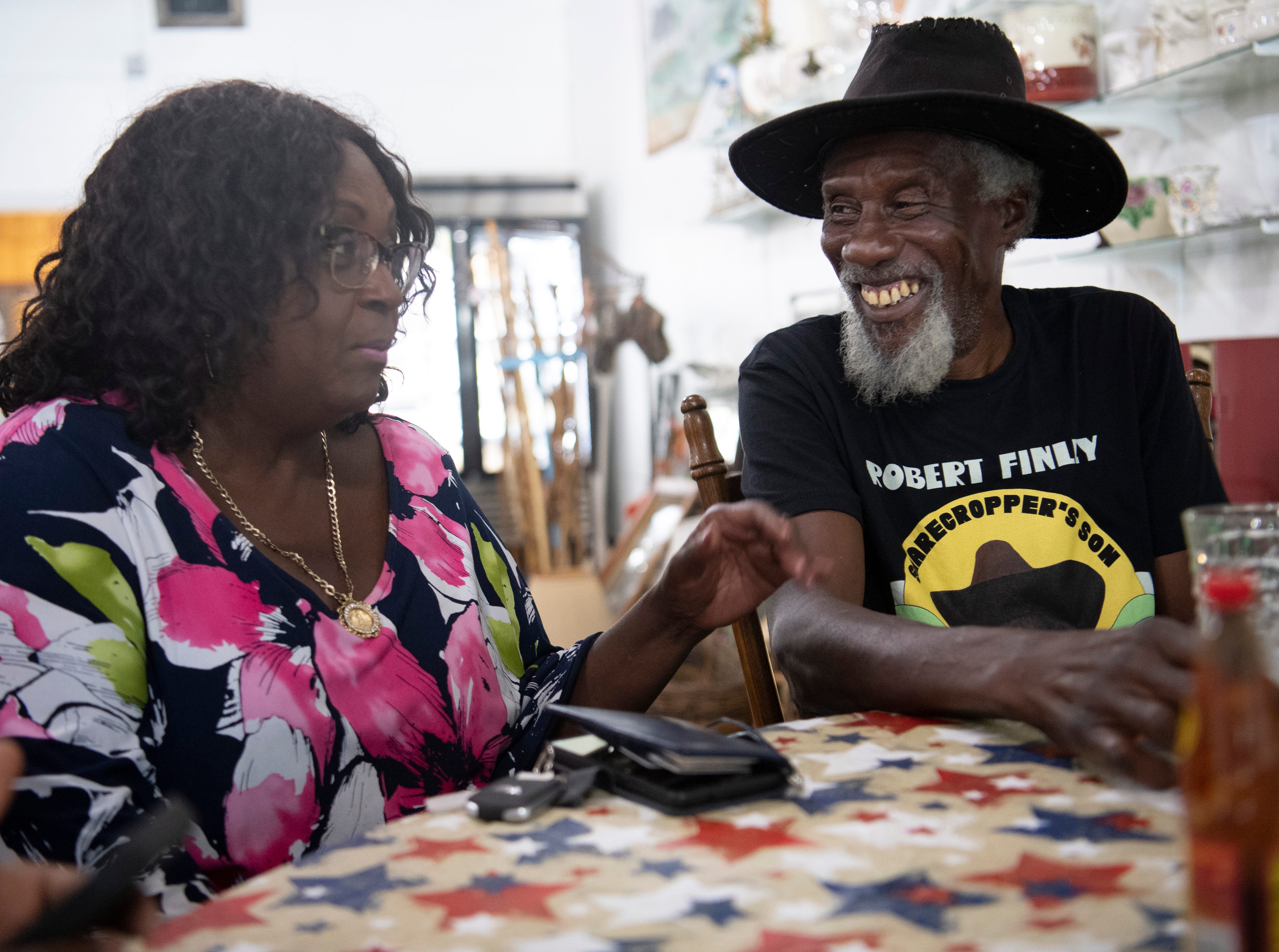 Mildred Ferguson gets ready to eat with Robert Finley at a restaurant in Bernice, La.  "He can sing with the kings and beggars, and he's the same," said Ferguson, who is the mayor of Bernice and a longtime friend. Photographed Friday, July 16, 2021.