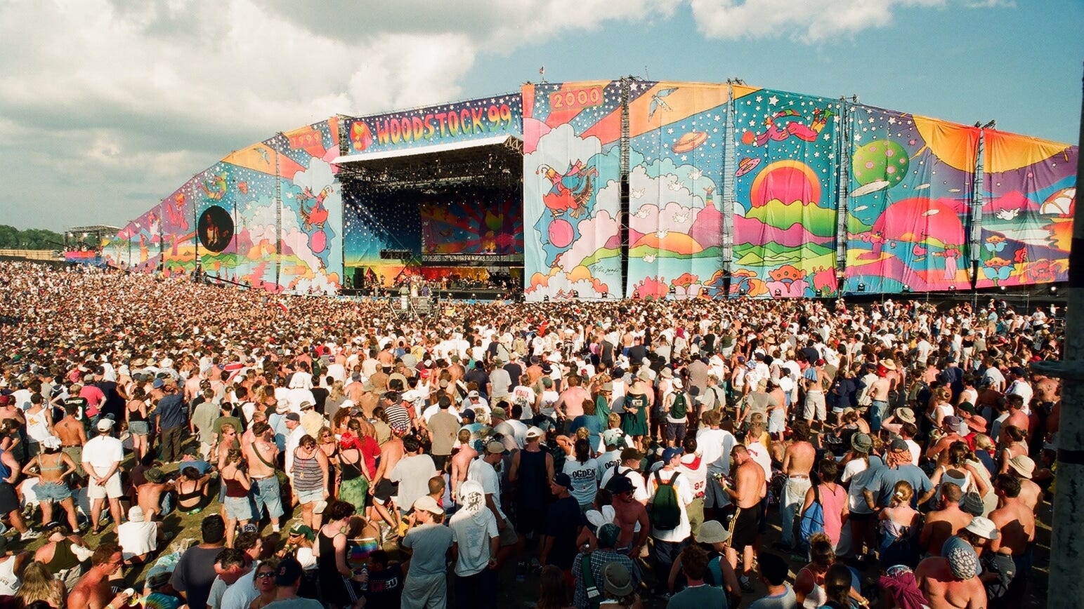A throng of people gather at one of the festival's stages. Estimates of attendees range from 225,000-400,000.