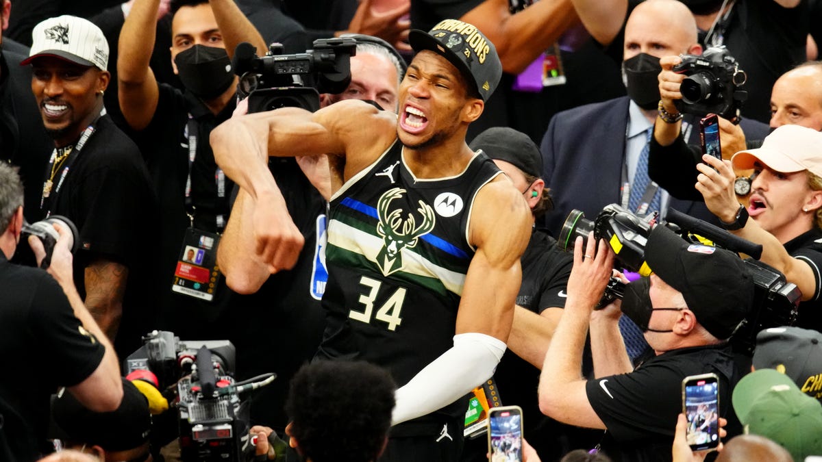 Giannis Antetokounmpo celebrates his first NBA championship.