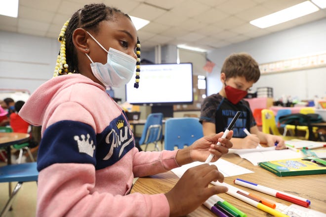 Tamyia Allen, 7, works on an art project detailing the four seasons with her fellow first graders during summer learning academy at Treadwell Elementary School on Wednesday, July 21, 2021. 