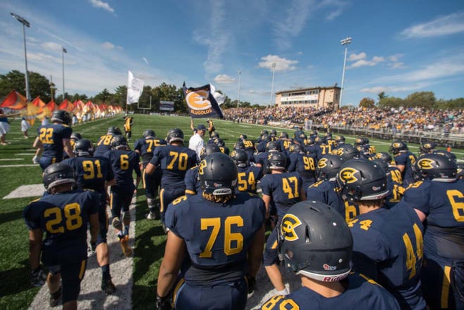 The UW-Eau Claire football team takes the field at a homecoming football game vs. River Falls at Carson Park in 2017.