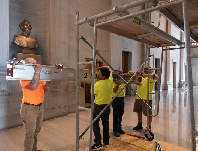 Workers prepare scaffolding at the Nathan Bedford Forrest bust in the State Capitol Thursday, July 22, 2021 in Nashville, Tenn.  The State Building Commission on Thursday gave approval for the relocation of the Forrest bust and two others to the Tennessee State Museum, a final step in a process that has taken more than a year since Gov. Bill Lee first said it was time for the statue to be moved.