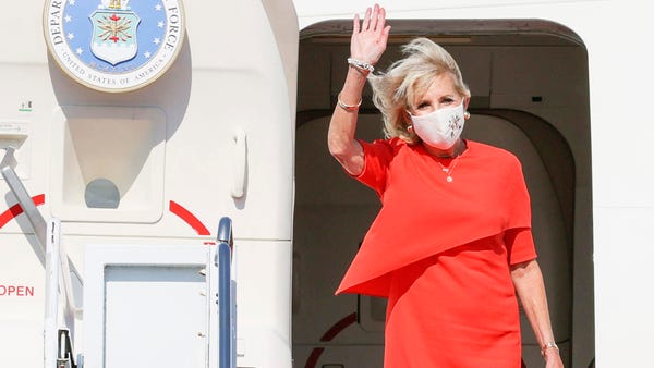 U.S. first lady Jill Biden waves upon arrival at Y