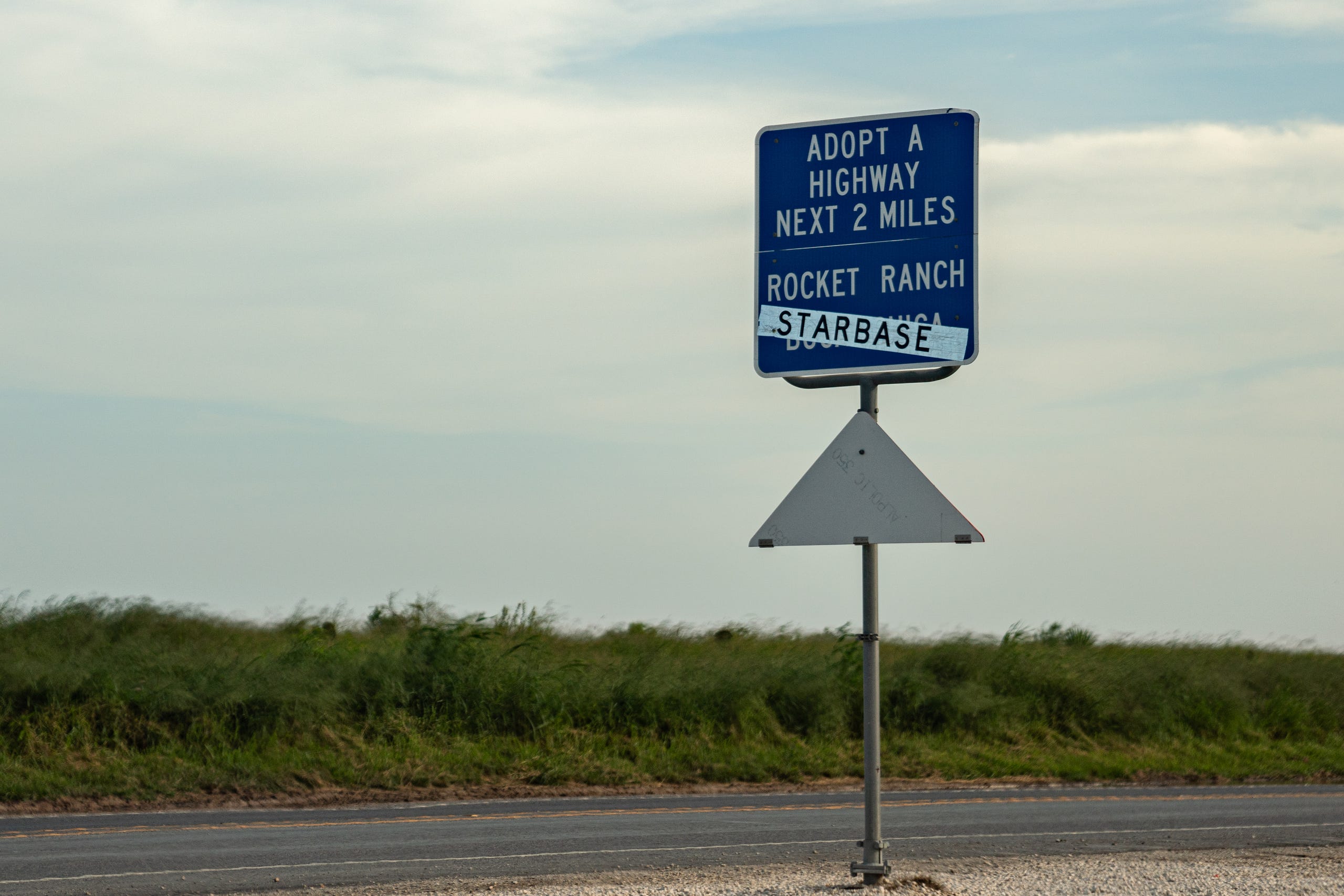 A road sign shows Boca Chica, another area near Brownsville, crossed out in favor of Starbase.