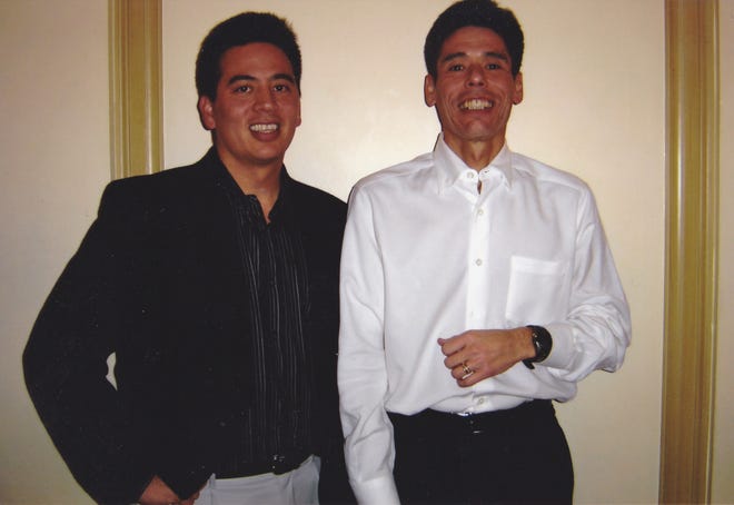 Craig Yabuki, left, poses with his brother Jeffery in 2001. In honor of his brother, who died by suicide, Jeffery Yabuki, former CEO of Fiserv Inc., gave Children's Wisconsin $20 million to put therapists in every one of their primary care and urgent care sites. The donation is having a transformative impact.